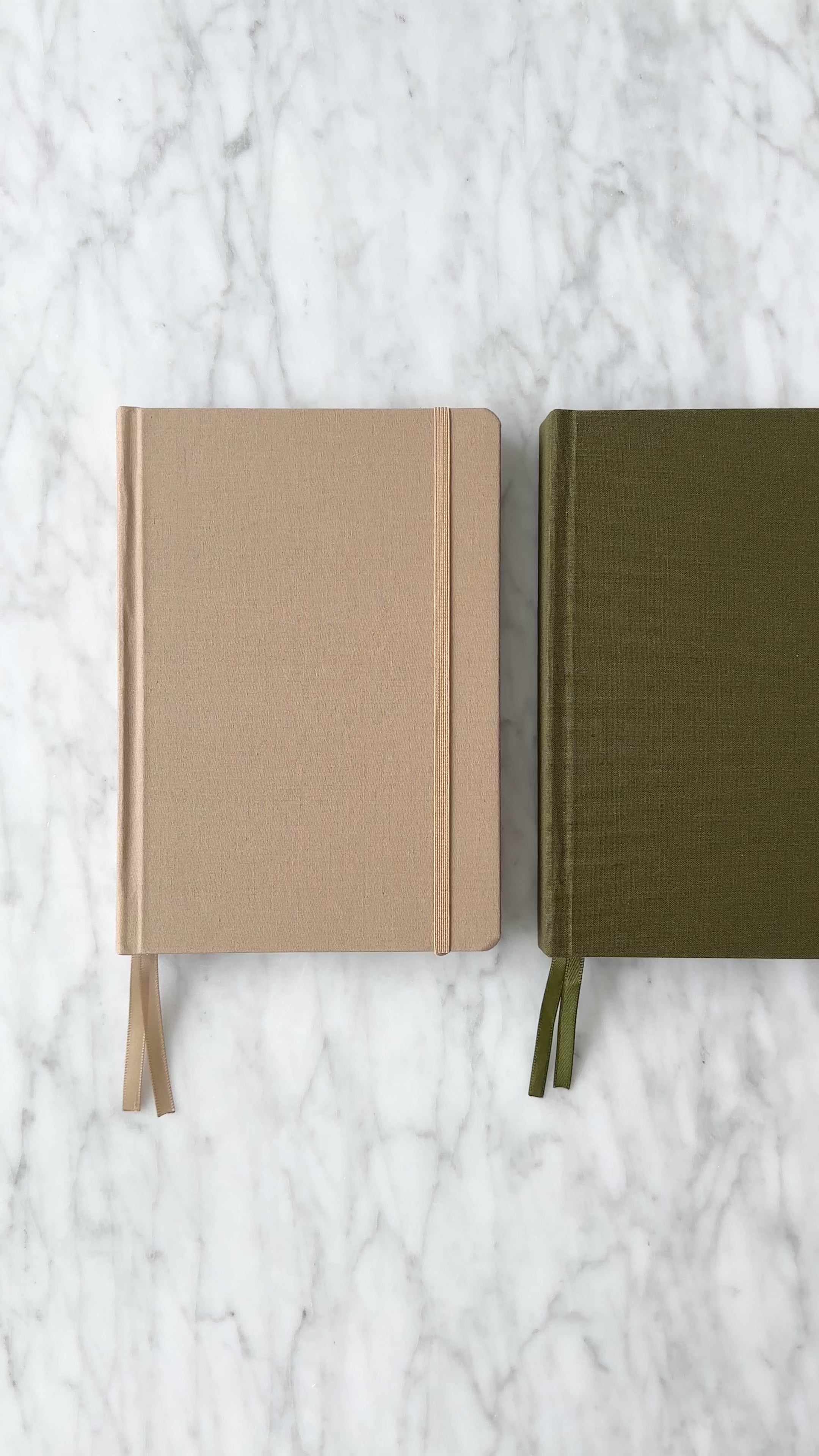 High quality linen hardcover bullet journals in black, brown, beige, and olive.